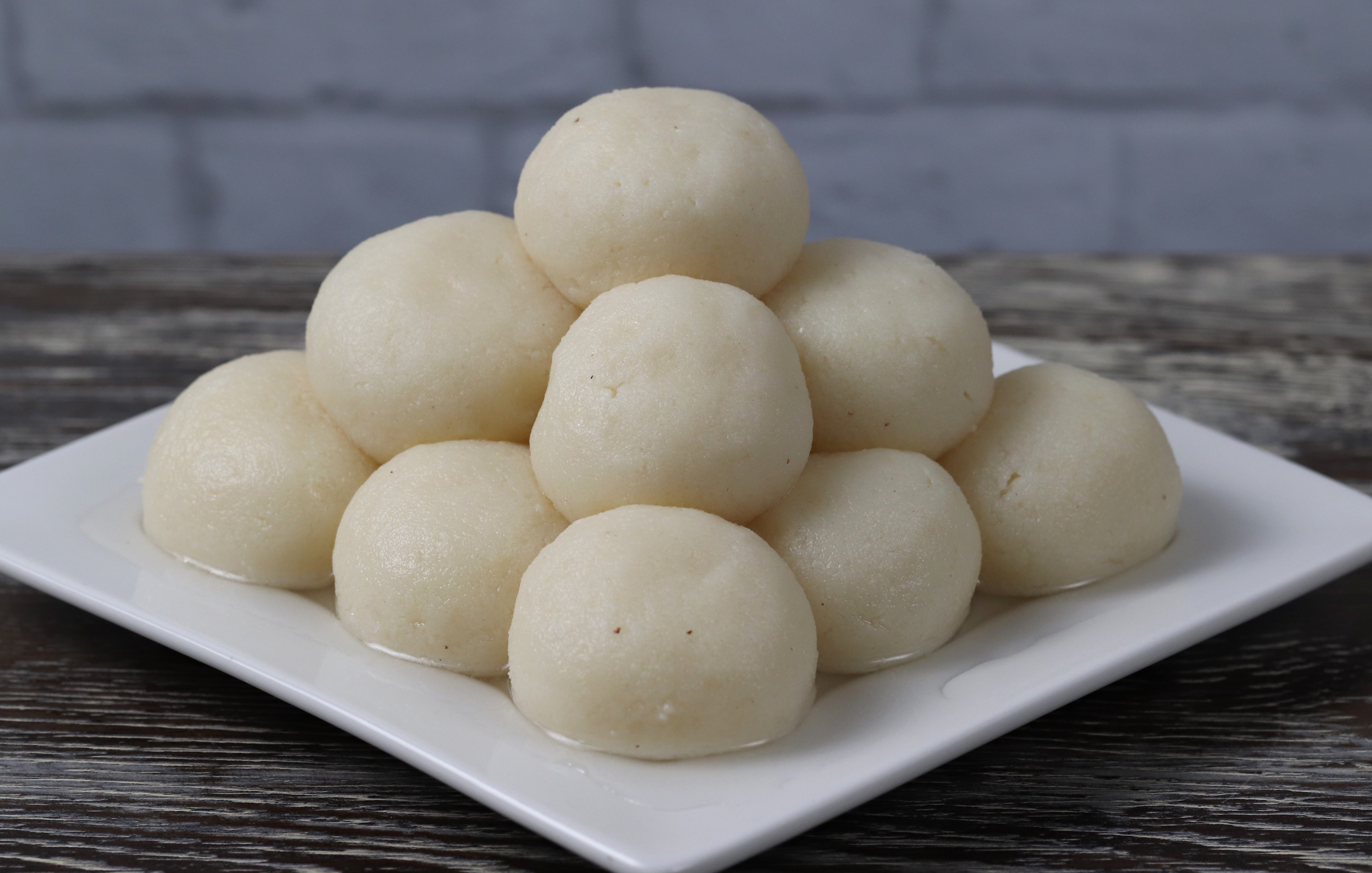 Rasgulla - Soft and spongy Bengali sweet balls in sugar syrup